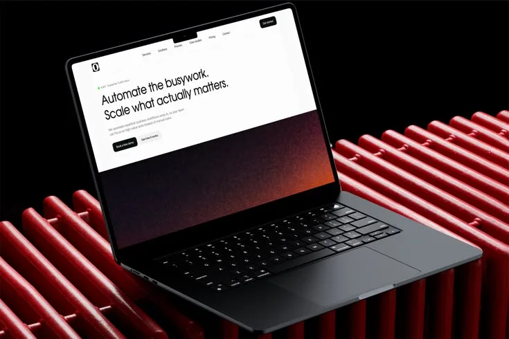 Laptop on a red ribbed stand showing a SaaS landing page